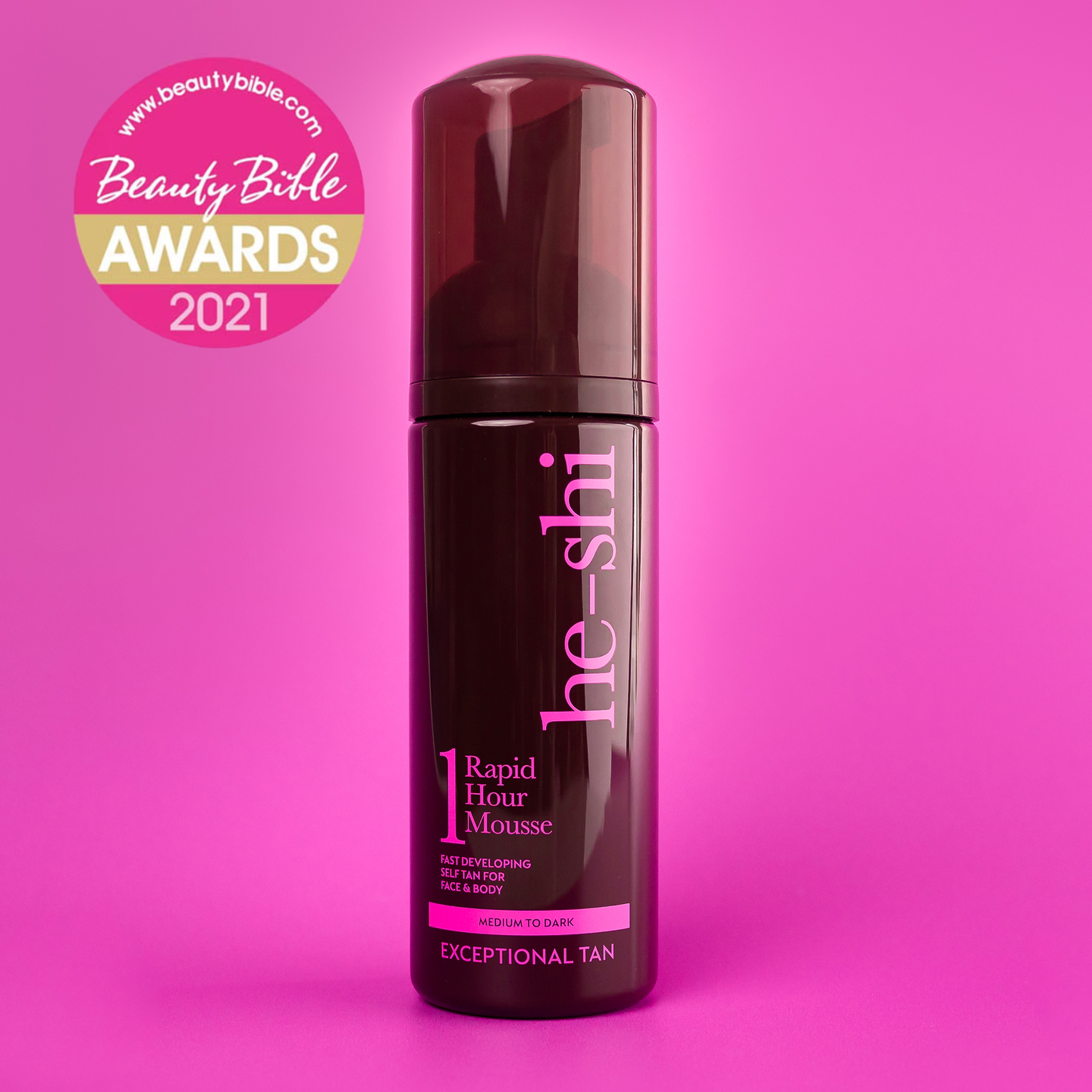 He-Shi Rapid 1 Hour Tanning Mousse bottle on pink background featuring a Beauty Bible Awards 2021 Logo